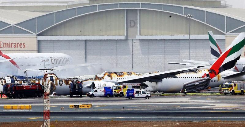 An Emirates airline Boeing 777 plane lays on the ground after crash landing at Dubai International Airport. EPA