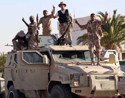 Joint forces affiliated with Libya's Government of National Unity assemble outside Tripoli International Airport on July 25. AFP