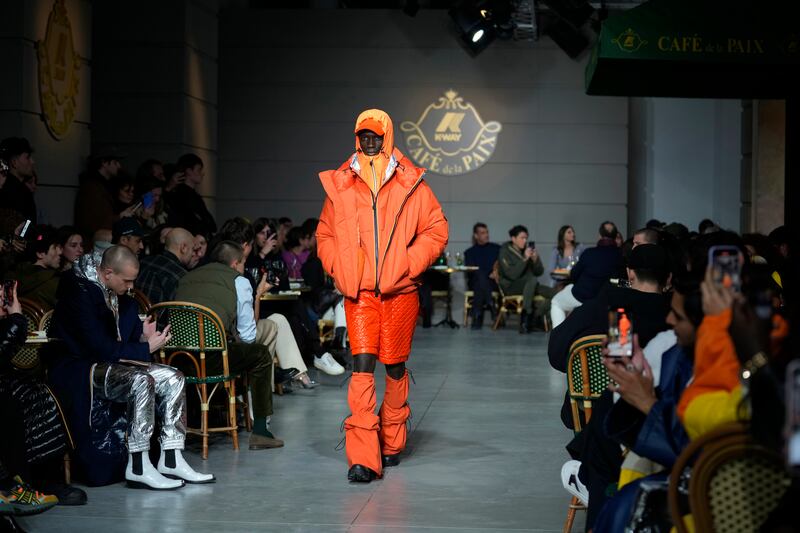 K-Way menswear autumn/winter 2023-24 featured short coats with matching boots that layer over slim body suits or quilted short-shorts and tops. AP