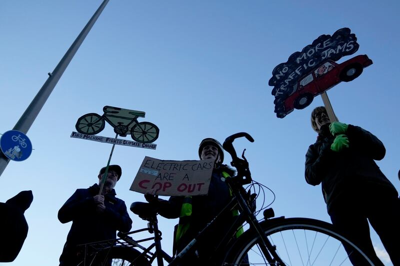 People take part in a pro-cycling rally outside the SEC (Scottish Event Campus), venue of Cop26, in Glasgow. AP Photo