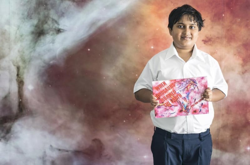 Child author Pritvik Sinhadc, 11, published his first book, When Dinosaurs Roamed the Earth, when he was 7 years old. He plans to publish three more books this year or early next year. Reem Mohammed / The National

