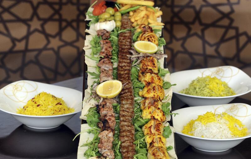 Dubai, United Arab Emirates - May 13, 2019: Iftar Signature Dish. Meter kebab from Shayan Restaurant at Swiss™tel. Monday the 13th of May 2019. Al Ghurair, Dubai. Chris Whiteoak / The National

Chefs description: A meter long kebab platter inspired by family dining in Shayan comes along different succulent kebabs such as Joojeh, kubideh and Masti. The whole set up comes along the various accompaniments. Joojeh is saffron flavoured chicken thigh kebab. Kubideh is minced lamb kebab flavoured with onion and parsley. Masti is Veal tenderloin kebab marinated in labneh and pepper.