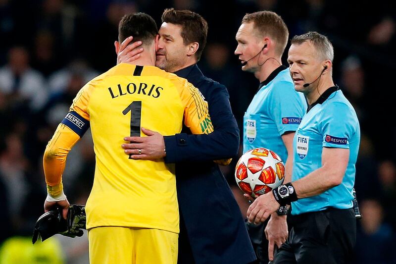 Tottenham Hotspur's Mauricio Pochettino hugs Hugo Lloris after the match. AFP