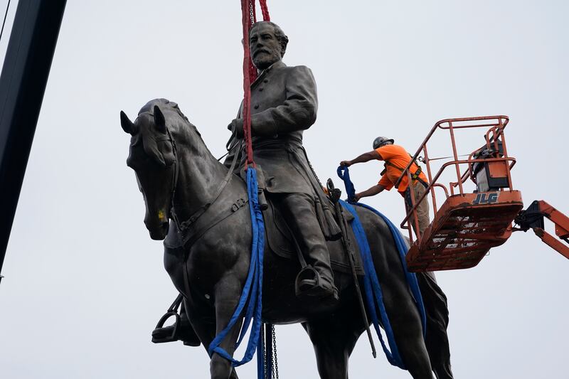 Crews remove one of America's largest remaining monuments to the Confederacy, a towering statue of Gen Robert E Lee on Monument Avenue, in Richmond. EPA