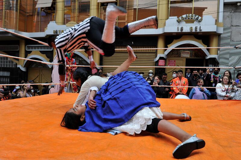 Fighting cholitas grapple at ElectroPreste. The festival brings together young people from all departments of Bolivia and fuses elements of Bolivian Andean culture with electronic music. AFP