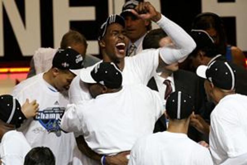Dwight Howard is mobbed by his Orlando Magic team mates.
