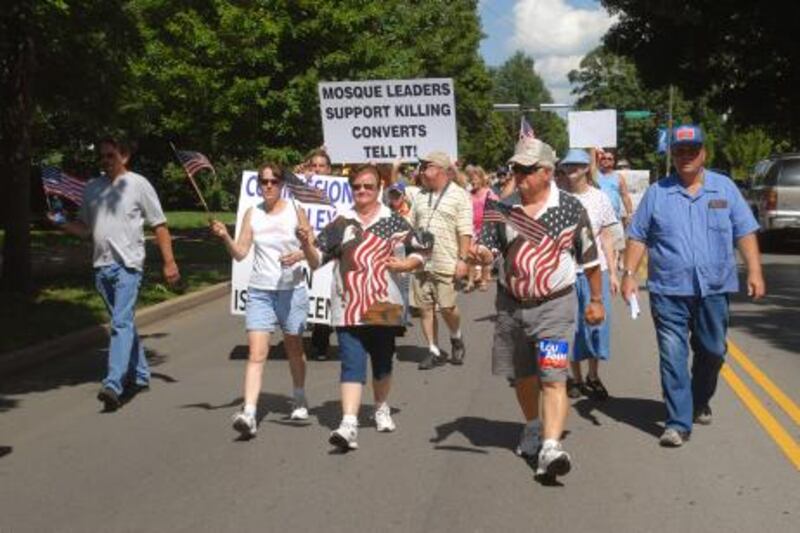 Protesters march during demonstration against a planned mosque and Islamic community center on Wednesday, July 14, 2010 in Murfreesboro, Tenn. Those opposing the mosque circulated a  petition asking the county commission to rescind approval of the facility.  (AP Photo/Christopher Berkey)