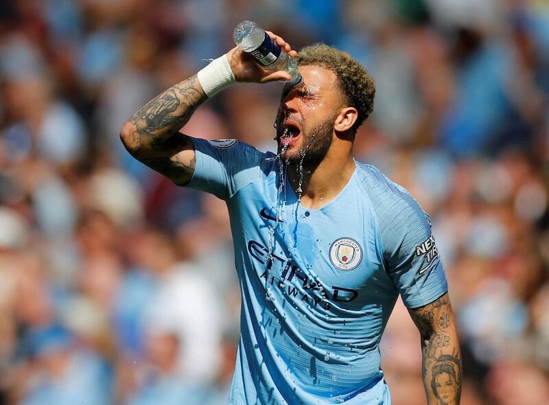 Manchester City's Kyle Walker pours water on himself. Reuters