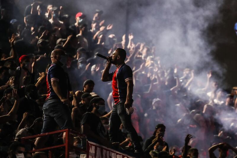 Paris Saint-Germain supporters react near Le Parc des Princes stadium after defeat by Bayern. EPA