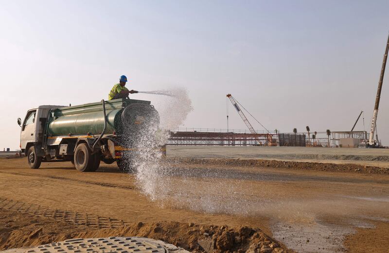 Workers prepare the Jeddah Street Circuit in the Red Sea Port city for the inaugural Saudi Arabian Grand Prix.