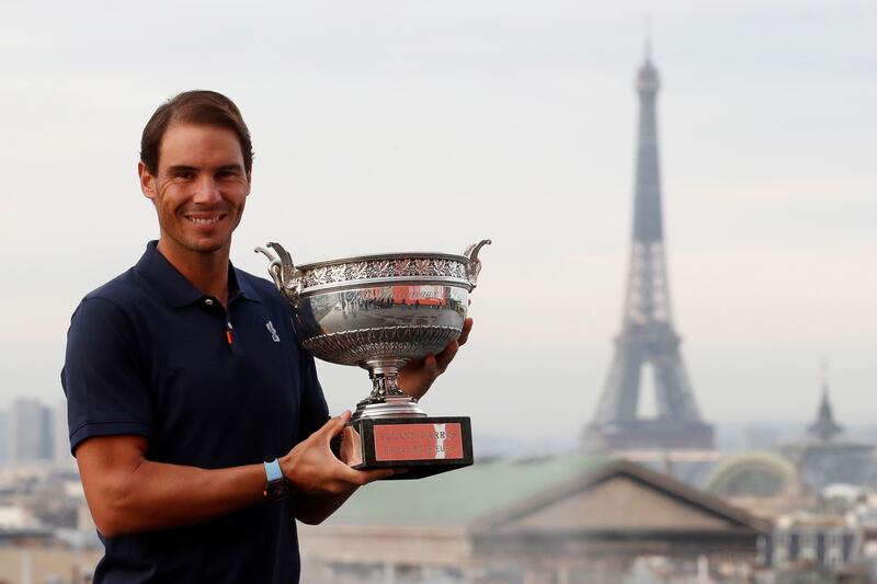 Tennis - French Open - Galeries Lafayette Rooftop, Paris, France - October 12, 2020  SpainÕs Rafael Nadal poses with the trophy after winning the French Open yesterday  REUTERS/Gonzalo Fuentes