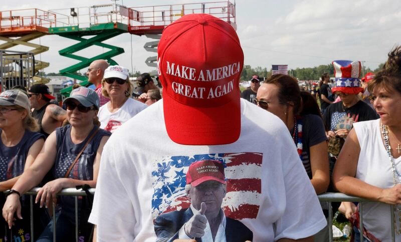 A man shows off his Maga hat. AFP