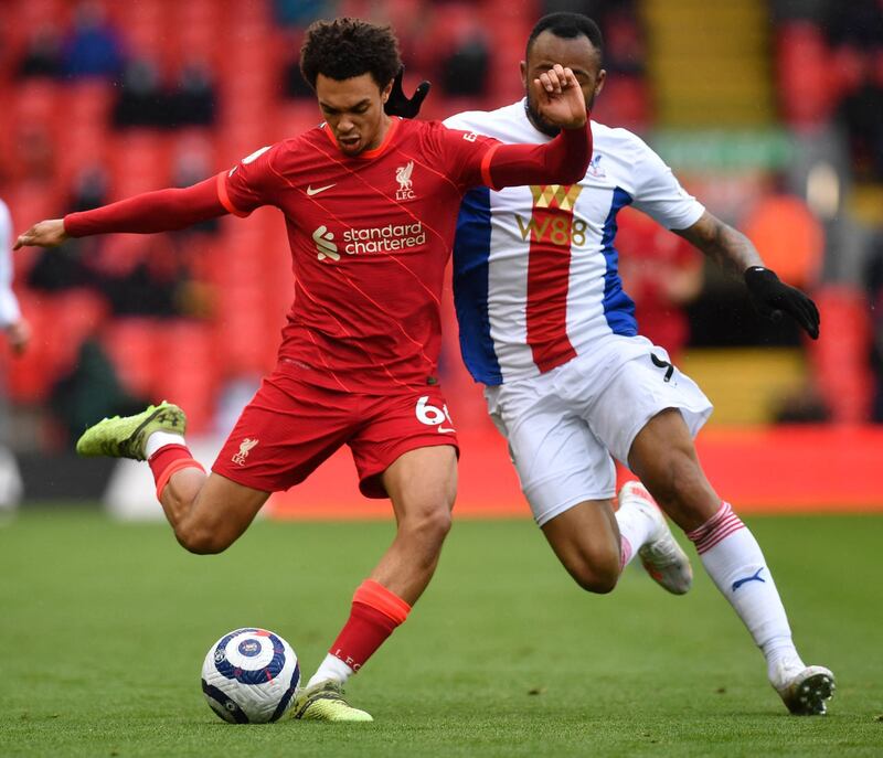 Liverpool full-back Trent Alexander-Arnold under pressure from Jordan Ayew of Palace. AFP