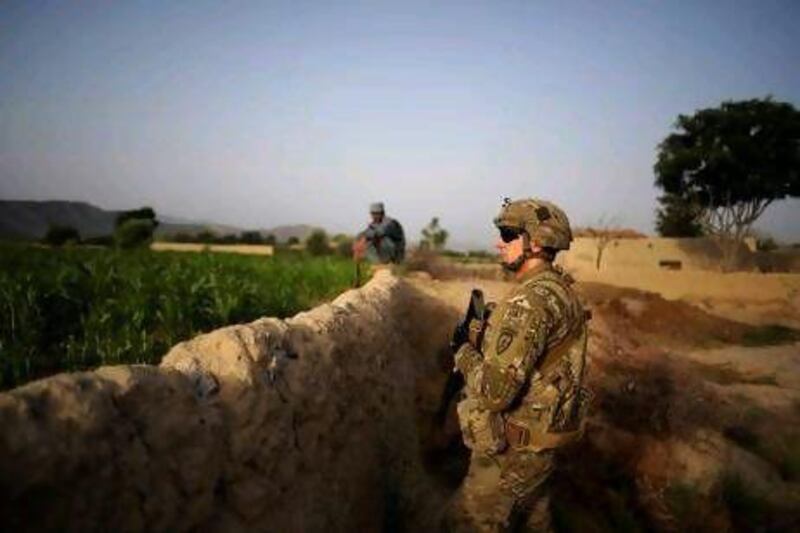 A US Army soldier guards a position during a patrol operation in the village of Zindah Kheyl, Afghanistan. A returned soldier said he sometimes received letters from grade school students addressed to ‘the brave marines in Iraq’.