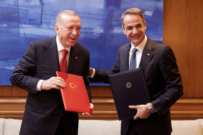 Greek Prime Minister Kyriakos Mitsotakis and Turkish President Tayyip Erdogan smile after signing a joint declaration to pursue good neighbourly relations at the Maximos Mansion in Athens, Greece, December 7, 2023. Dimitris Papamitsos/Greek Prime Minister’s Office/Handout via REUTERS THIS IMAGE HAS BEEN SUPPLIED BY A THIRD PARTY. 