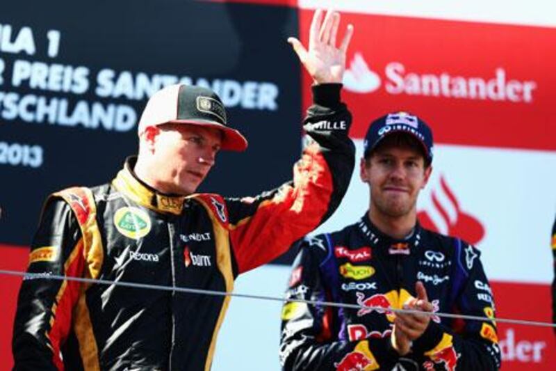 Kimi Raikkonen, left, is a potential teammate of Sebastian Vettel at Red Bull next season. Paul Gilham / Getty Images
