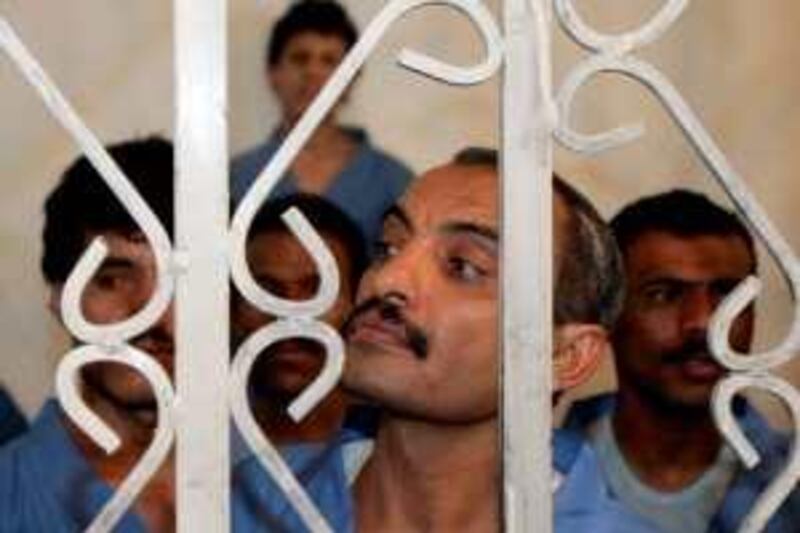 Abdul-Aziz al-Abdi (C), a Yemeni Muslim, listens to a verdict at a court in Amran, western Yemen in this March 2, 2009 file photo. An appeals court in Yemen sentenced to death on June 21, 2009, a man who shot dead a Jewish compatriot. In March a court ruled the man, Abdul-Aziz al-Abdi, was mentally unstable and sent him to an psychiatric institution, but the victim's father appealed the verdict.  REUTERS/Khaled Abdullah/Files (YEMEN POLITICS CRIME LAW RELIGION) *** Local Caption ***  AMR03_YEMEN-JEW-_0621_11.JPG
