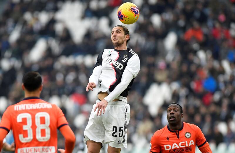 Juventus' Adrien Rabiot heads the ball. Reuters