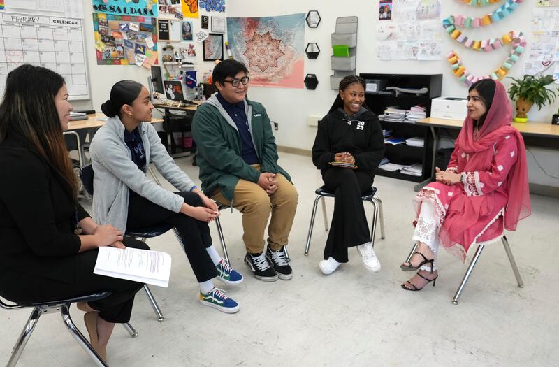 Nobel Peace Prize laureate Malala Yousafzai, right, discusses the film with students at Animo Jackie Robinson Charter High School. AP Images 