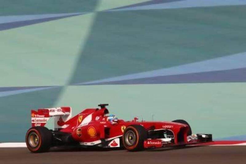 At the Bahrain Grand Prix in April, Fernando Alonso was going strong in his Ferrari but faulty drag-reduction system meant Sebastian Vettel, next, cashed in. Ahmed Jadallah / Reuters