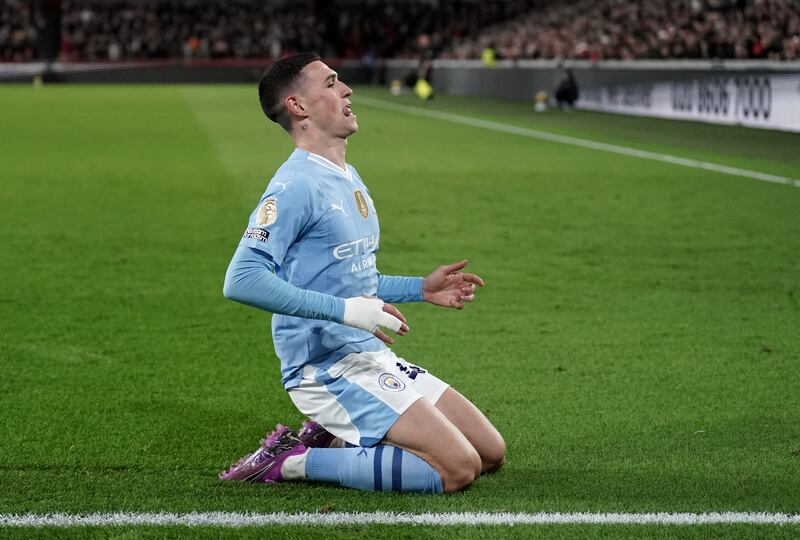Manchester City's Phil Foden celebrates scoring the second goal against Brentford. PA