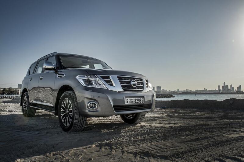  Nissan Patrol V6 with Abu Dhabi skyline behind. The Japanese car maker has seen earnings rise. Vidhyaa / The National

