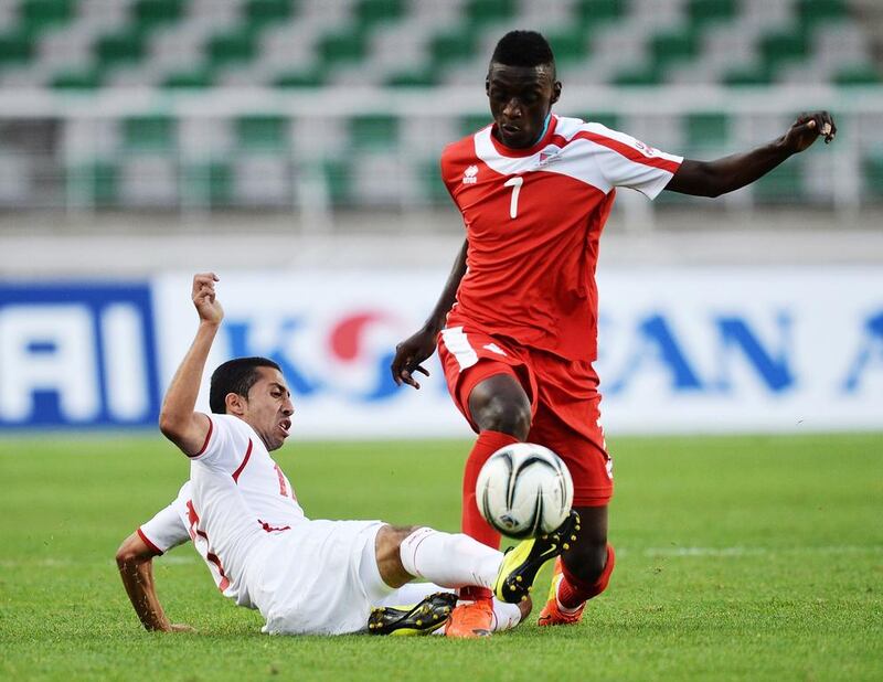 A defeat in the game against Jordan has meant the UAE, in red, finished second in Group G and will play Vietnam, the Group H toppers. Manan Vatsyayana / AFP