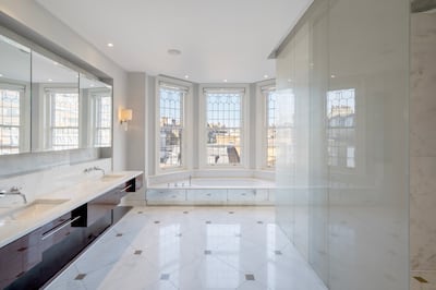 The main bathroom has twin marble basins, a marble bath and a separate walk-in shower. Photo: Beauchamp Estates