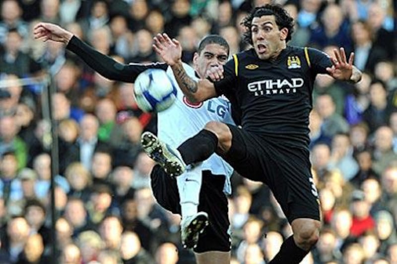 Carlos Tevez, right, scored Manchester City's second and decisive goal against Fulham.