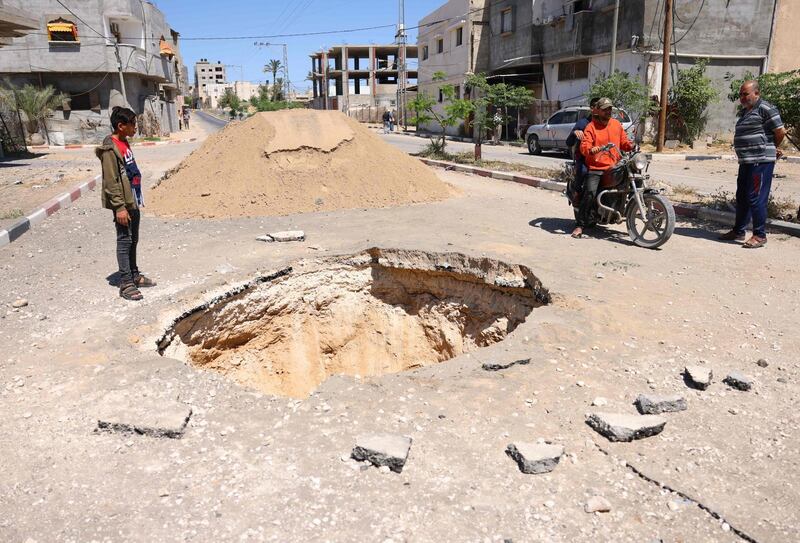 Palestinians check the aftermath of Israeli air strikes in Rafah in the southern Gaza Strip. Deafening air strikes and rocket fire once more shook Gaza overnight and early Wednesday amid an international diplomatic push to broker a ceasefire after more than a week of bloodshed. AFP