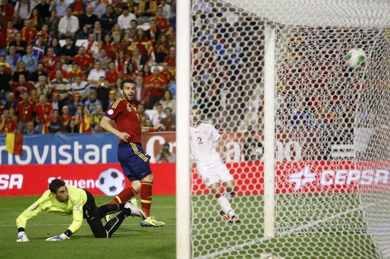 Manchester City forward Alvaro Negredo scores in the 26th minute to put Spain ahead on Tuesday night. Juan Medina / Reuters