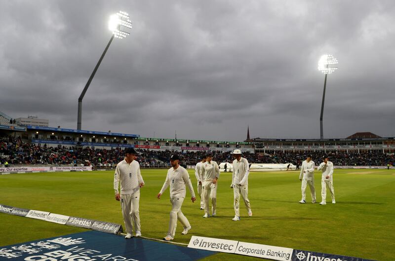 Cricket - England vs West Indies - First Test - Birmingham, Britain - August 18, 2017   England players leave the field as rain suspends play    Action Images via Reuters/Paul Childs