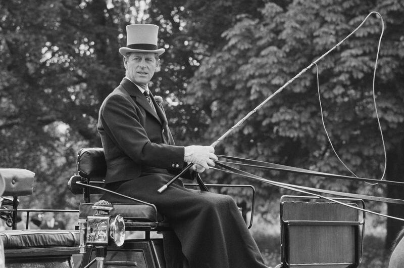 Prince Philip, Duke of Edinburgh, driving a carriage, UK, 28th May 1975. (Photo by Robin Jones/Evening Standard/Hulton Archive/Getty Images)