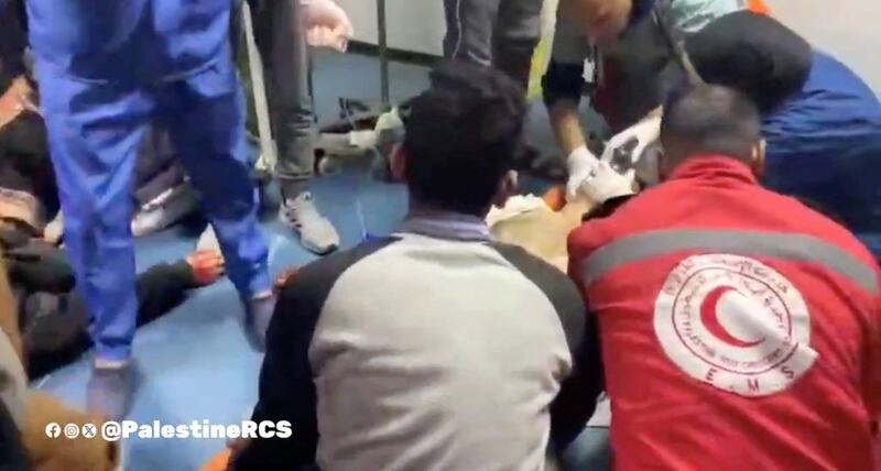 A screengrab of medics treating a patient on the floor at Al Amal Hospital in Khan Younis, southern Gaza. Photo: Palestine Red Crescent Society