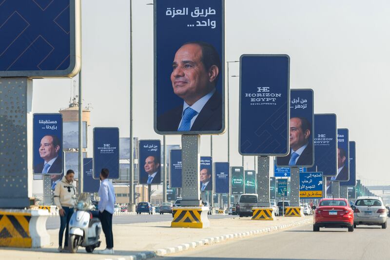 Billboards bearing the image of Abdel Fattah El Sisi line a road in the New Cairo district of the Egyptian capital. Bloomberg