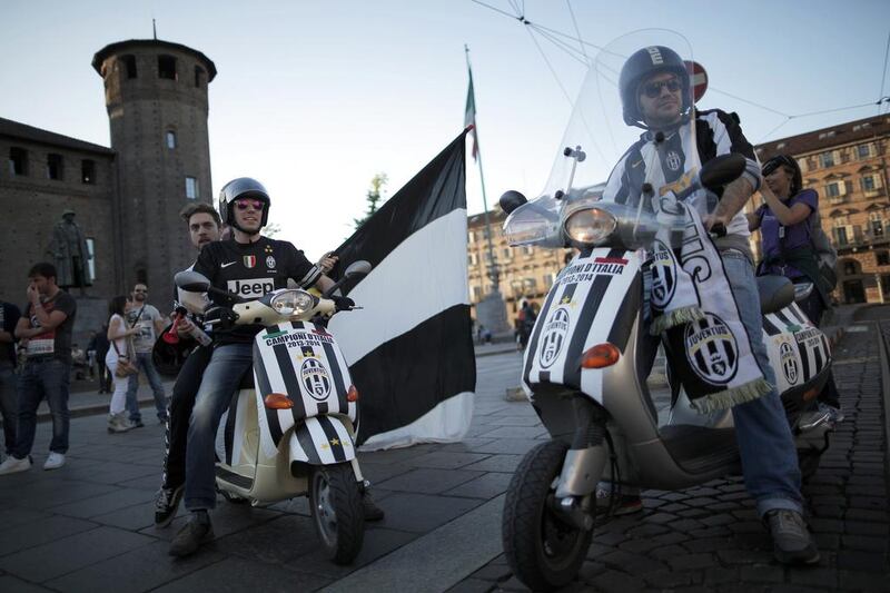 Juventus supporter's celebrate the club's 30th Italian Serie A title on Sunday. Marco Bertorello / AFP / May 4, 2014