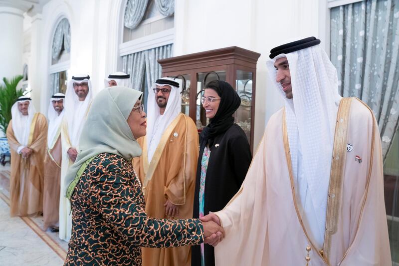 SINGAPORE, SINGAPORE - February 28, 2019: HE Halimah Yacob, President of Singapore (L), greets HE Dr Thani Al Zeyoudi, UAE Minister for Climate Change and Environment (R), prior to a meeting, at the Istana presidential palace.
 ( Mohamed Al Hammadi / Ministry of Presidential Affairs )
—