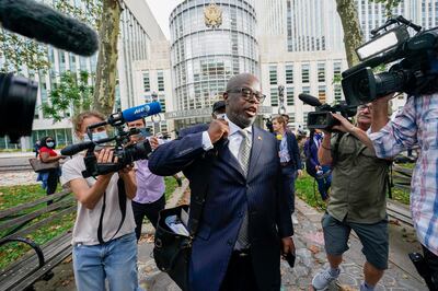 R Kelly's attorney Deveraux Cannick leaves Brooklyn Federal court during the R&B star's trial in New York. AP