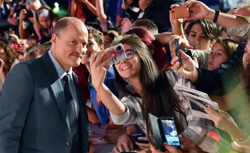 Woody Harrelson poses for selfies with fans on the red carpet for the premiere of the film 'Three Billboards Outside Ebbing Missouri. Ettore Ferrari / ANSA via AP