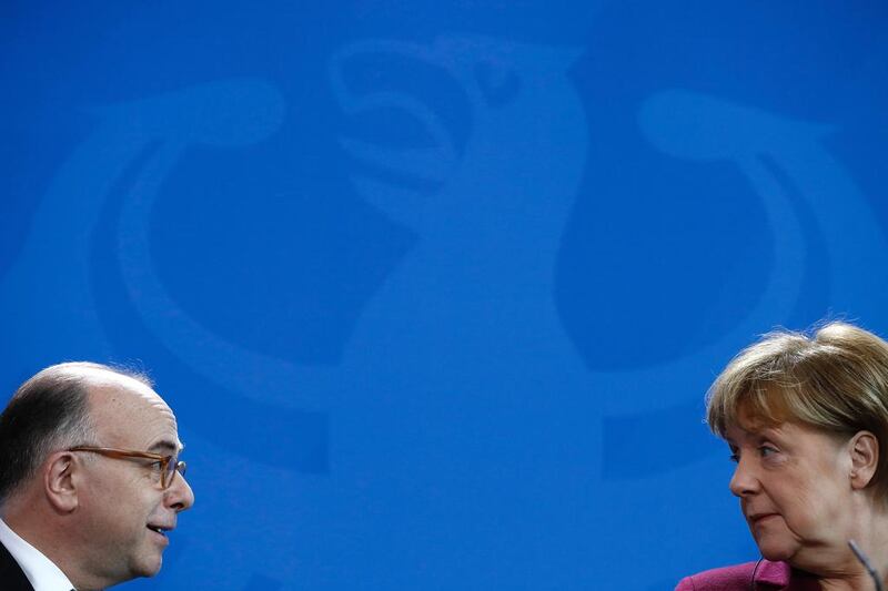German Chancellor Angela Merkel and French Prime Minister Bernard Cazeneuve give a joint press conference at the Chancellery in Berlin. Odd Andersen / AFP