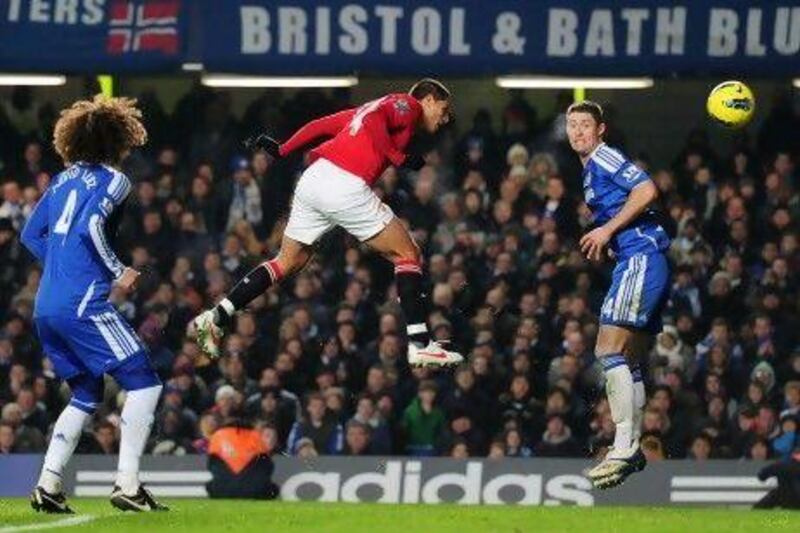 Javier Hernandez of Manchester United jumps between David Luiz, left, and Gary Cahill to score Manchester United's equaliser against Chelsea.