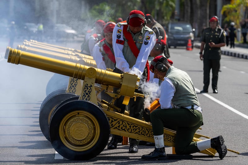 Military police fire gun salutes after as part of the celebrations. AFP
