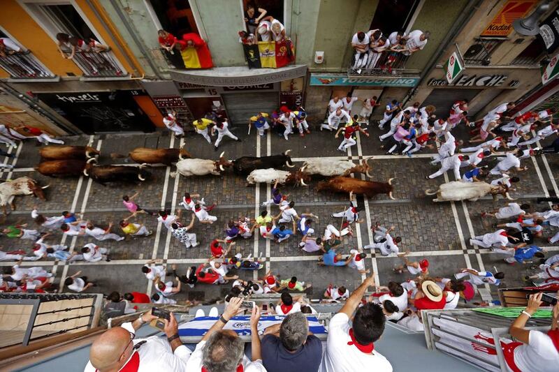 Bulls of the Pedraza de Yeltes ranch chase runners or ‘mozos’ during the fourth bull run at the Festival of San Fermin 2016 in Pamplona, Spain. Javier Lizon / EPA
