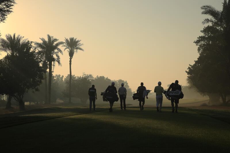 Players walk down the second during Day 1. Getty