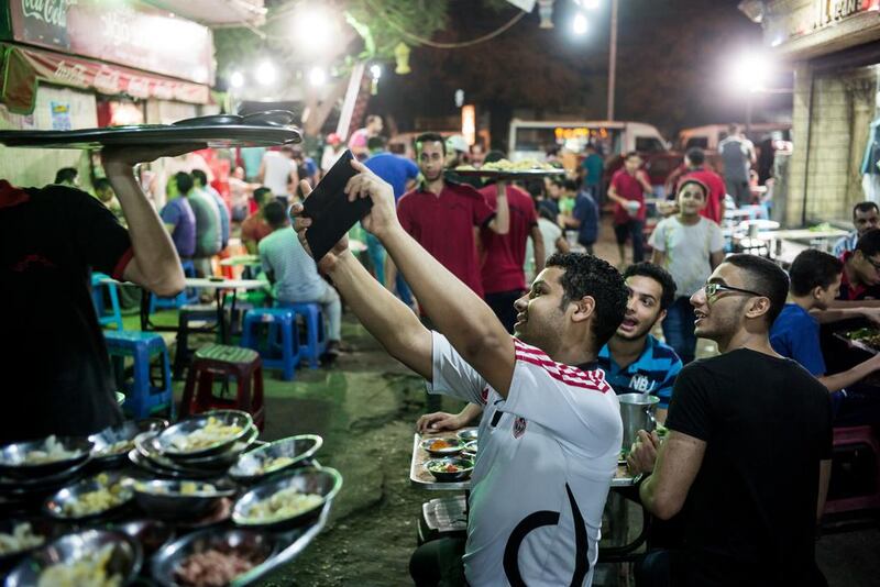 Customers snapping selfies at Wimby as people gather for a bit of fun during suhoor. David Degner for The National