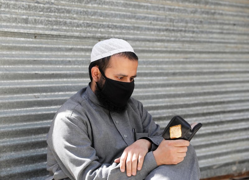 An Afghan man reads the Quran on the first day of Ramadan in Kabul. Reuters