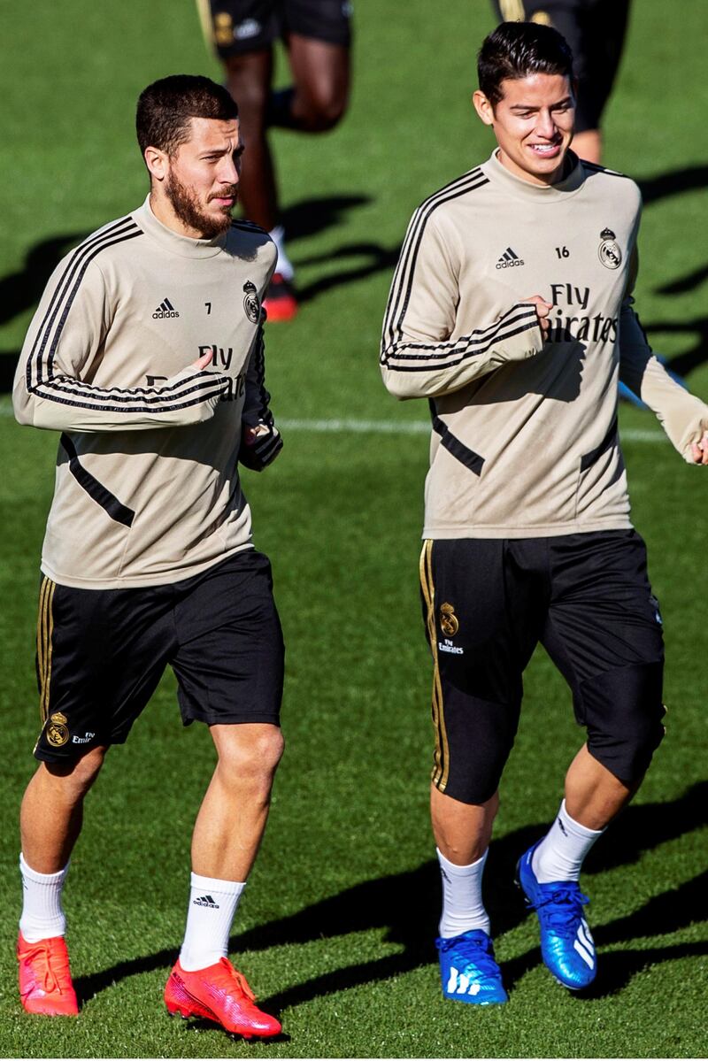 Eden Hazard and James Rodriguez jog during Real Madrid's training session. EPA