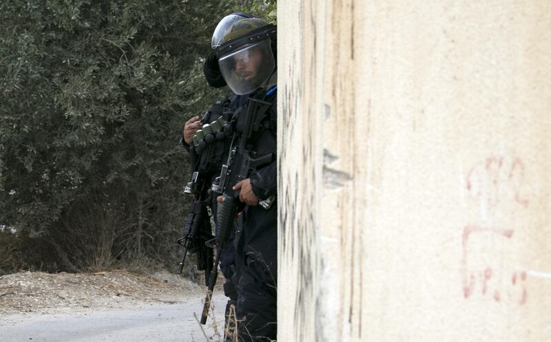 Israeli forces stand guard in the village of Shuwaykah where the man who shot dead two Israelis earlier used to live, in the occupied West Bank. AFP