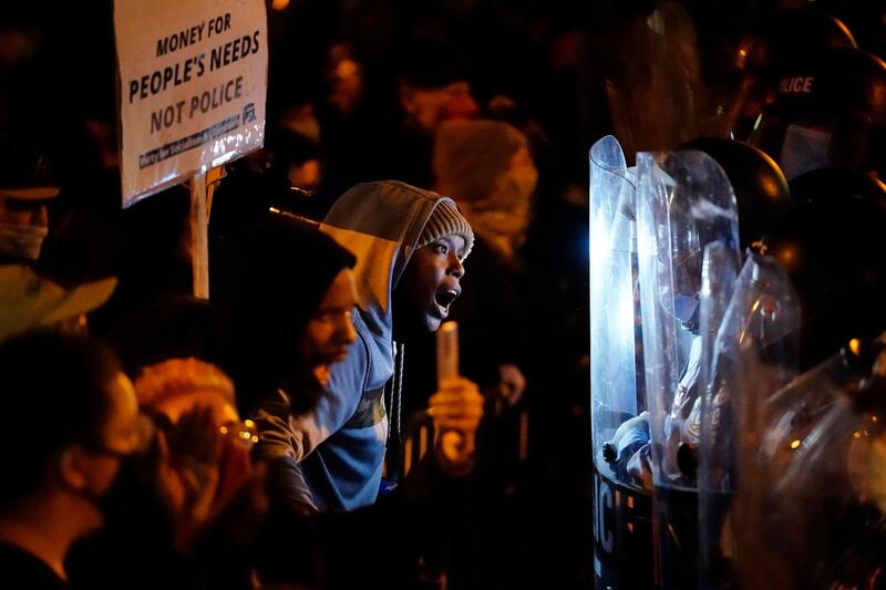 Protesters confront police during a march in Philadelphia.. AP Photo