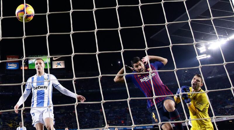 Luis Suarez, second right, scores Barcelona's second goal against Leganes. AP Photo